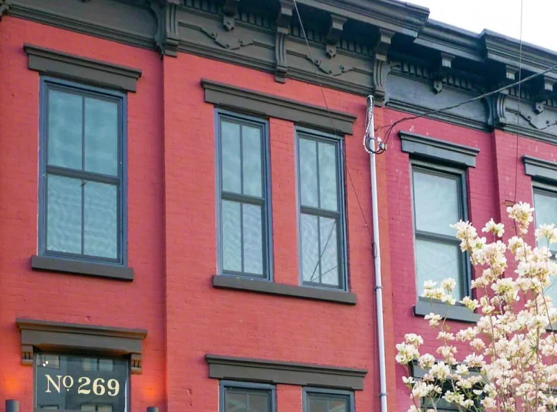 Classic red-brick Richmond, VA rowhouse with double-hung windows