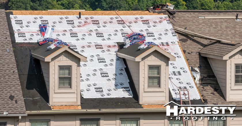 GAF underlayment installed across a roof deck mid-replacement